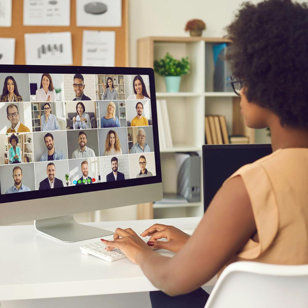 Woman having an online business conference or a video call meeting with colleagues